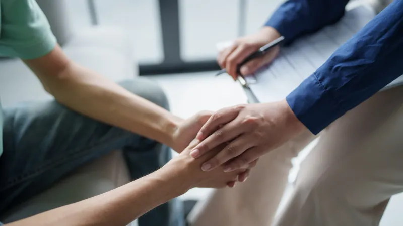 Professional Psychotherapy Taking Note During Appointment